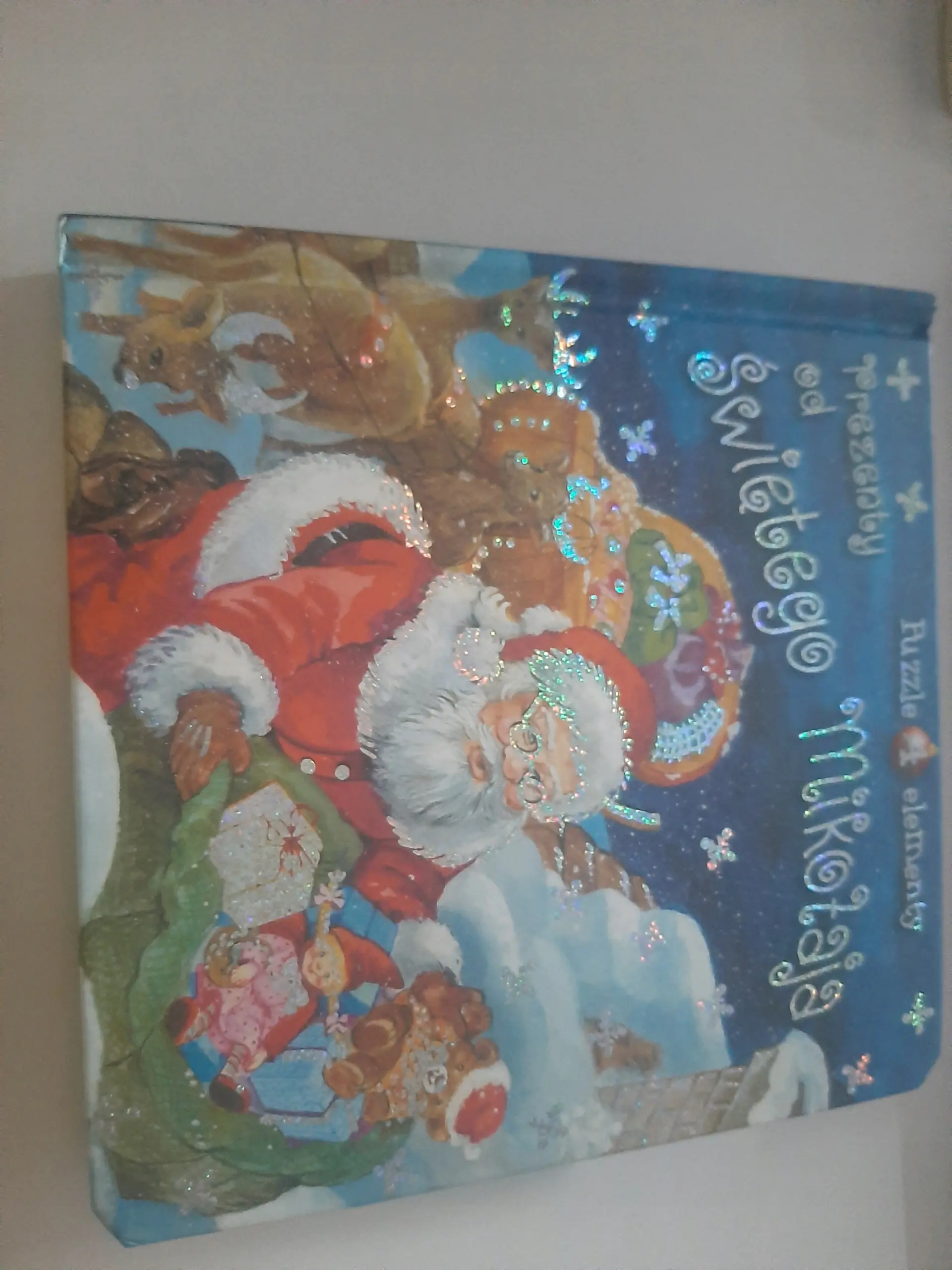 Książka - Prezenty od Świętego Mikołaja. Książka z puzzlami