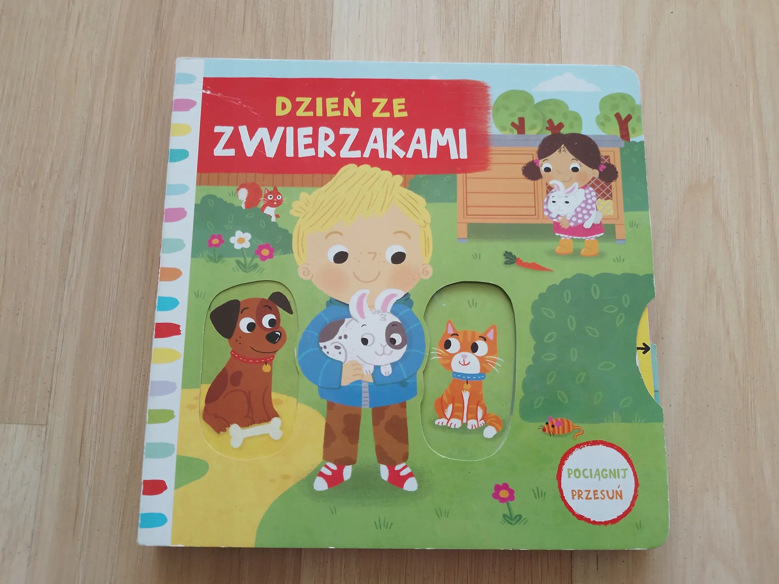 Książka - Dzień ze zwierzakami. Pociągnij-przesuń