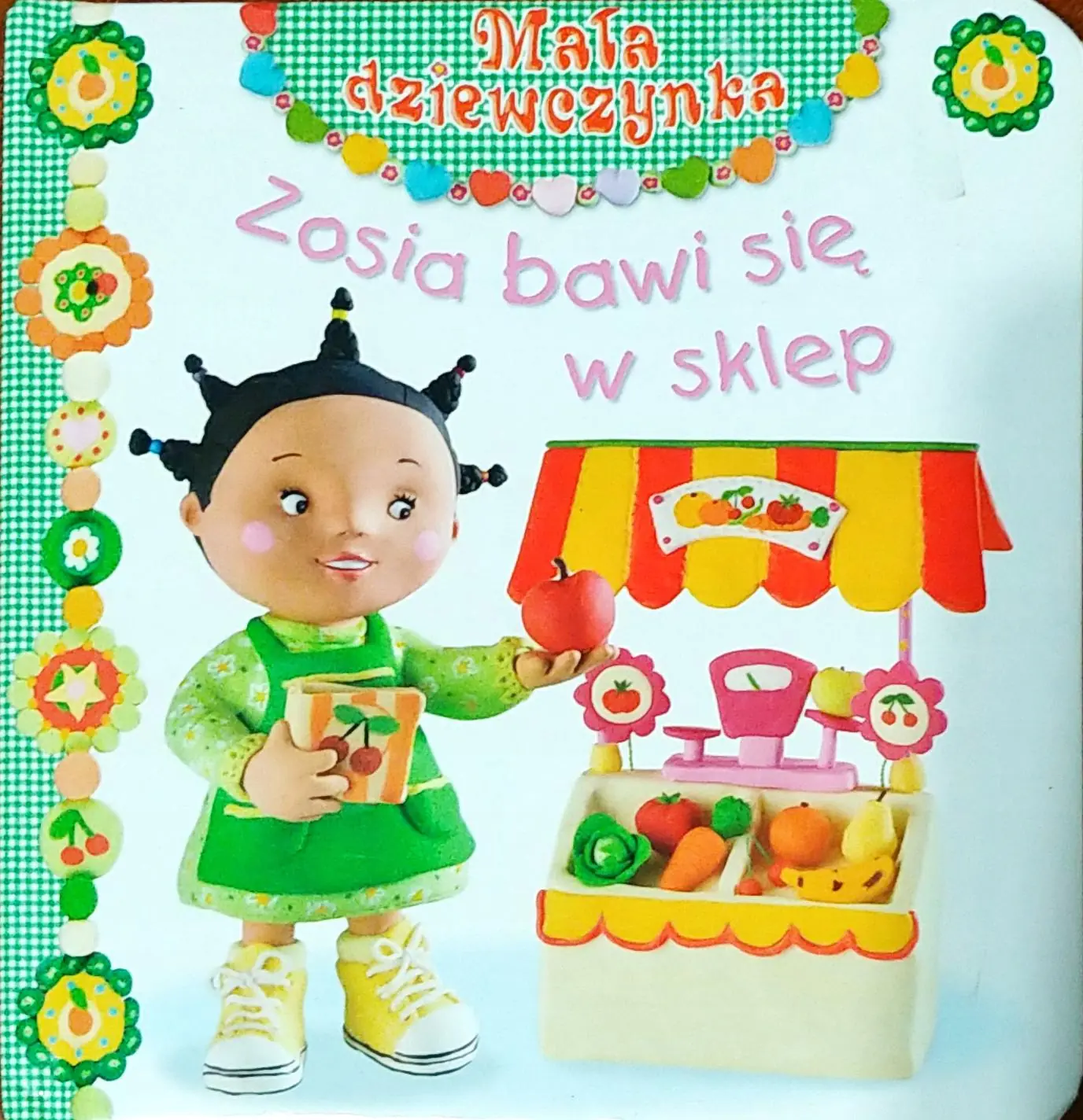 Książka - Mała dziewczynka. Zosia bawi się w sklep