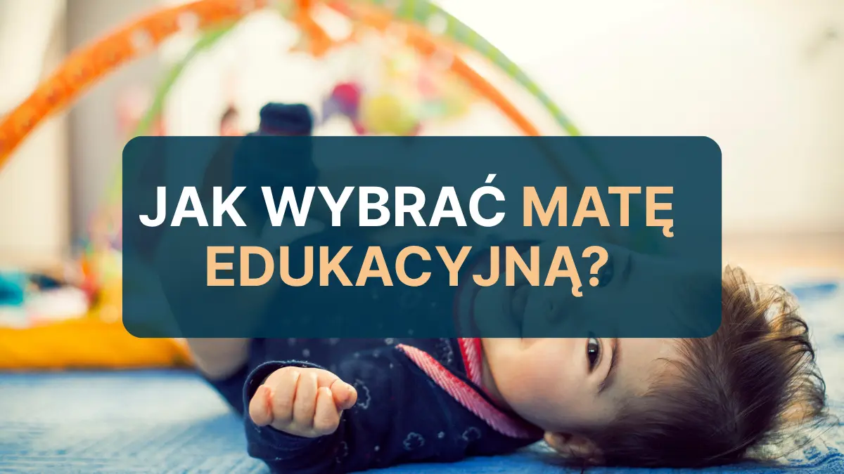 Obrazek przedstawia niemowlę leżące obok maty edukacyjnej.